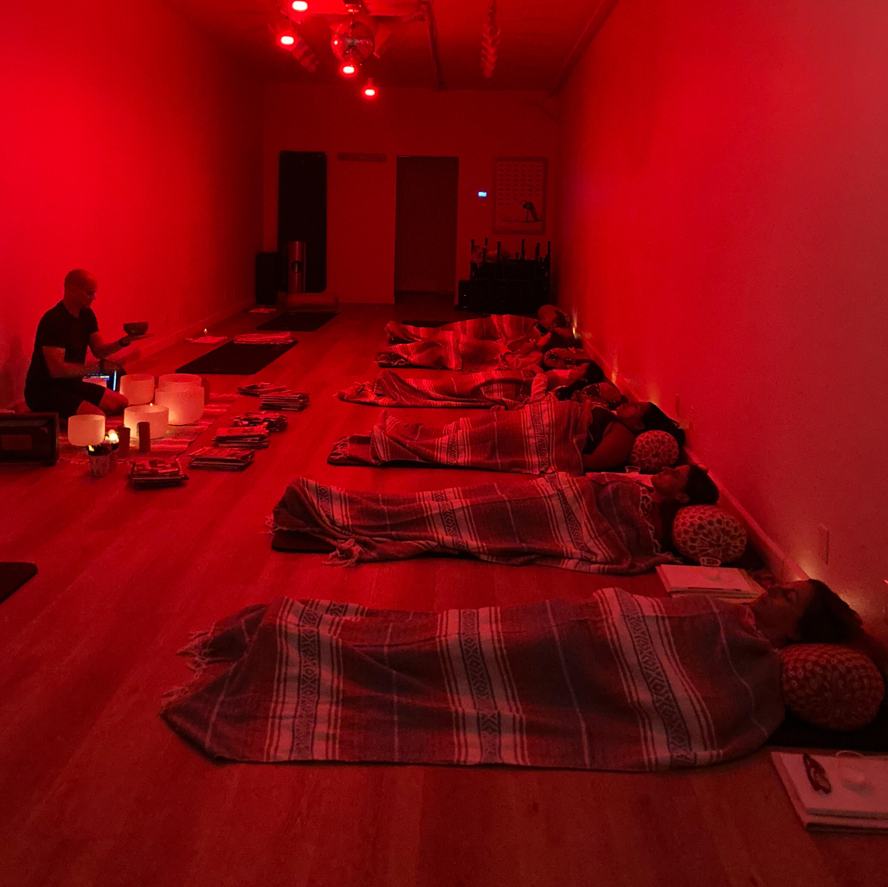 participants in the Harmony & Vision sound bath with art event proudly display their collage art